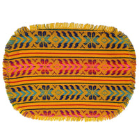 Colorful woven placemat with geometric pattern on a white background