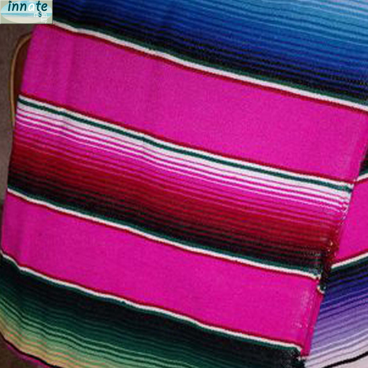 Close-up of colorful striped fabric with pink, blue, and green hues.